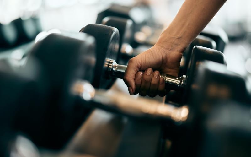 close-up of a person holding a dumbbell