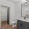 bathroom with a connected walk-in closet