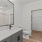 bathroom with a large mirror