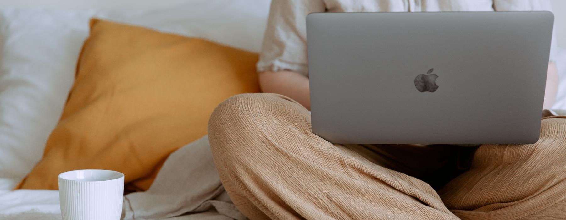 a laptop on a bed