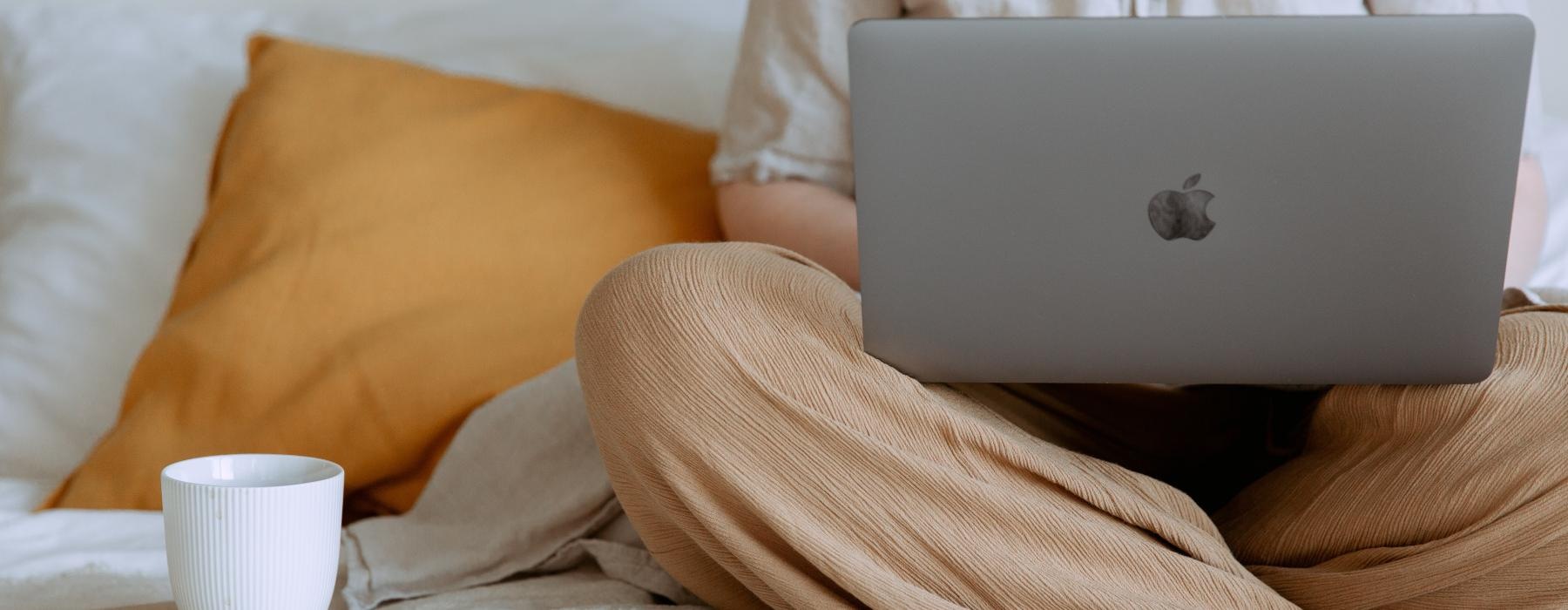 a laptop on a bed